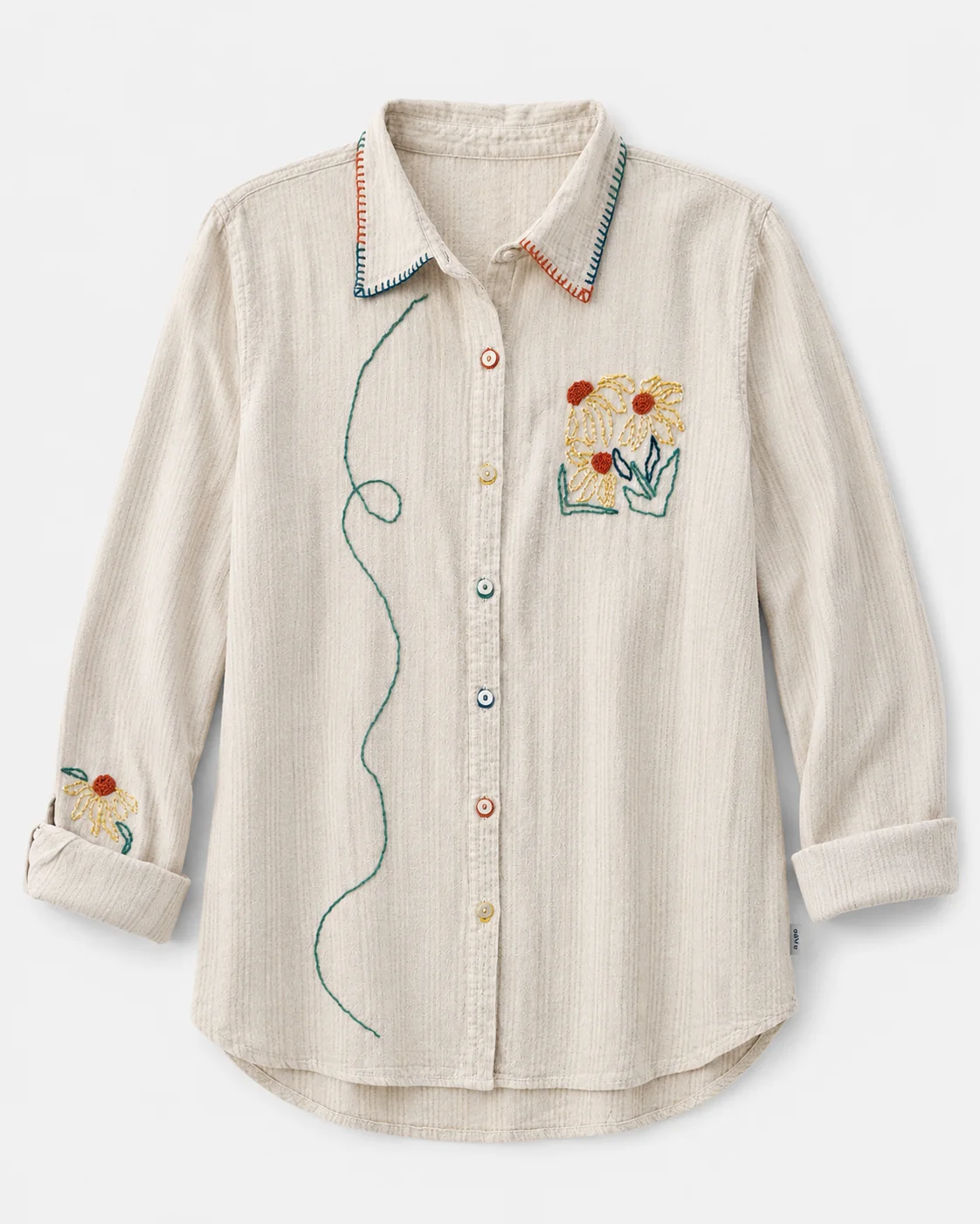 Sunny — natural linen-blend shirt with hand-embroidered wildflowers in mustard, rust and teal and stitched vine detail, flat lay