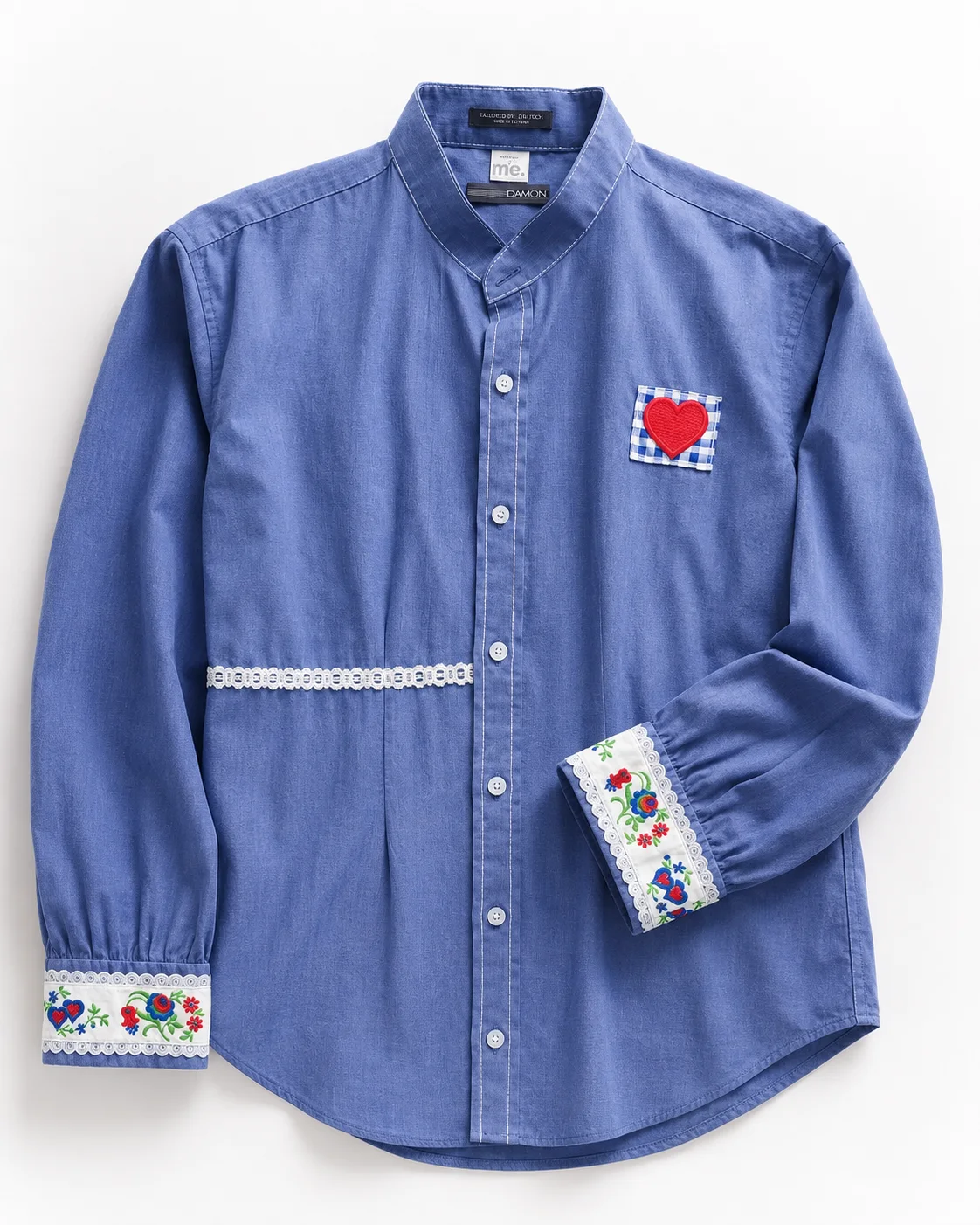 Aggie — soft blue button-front shirt with embroidered floral cuffs, lace waist detail and red gingham heart appliqué, flat lay