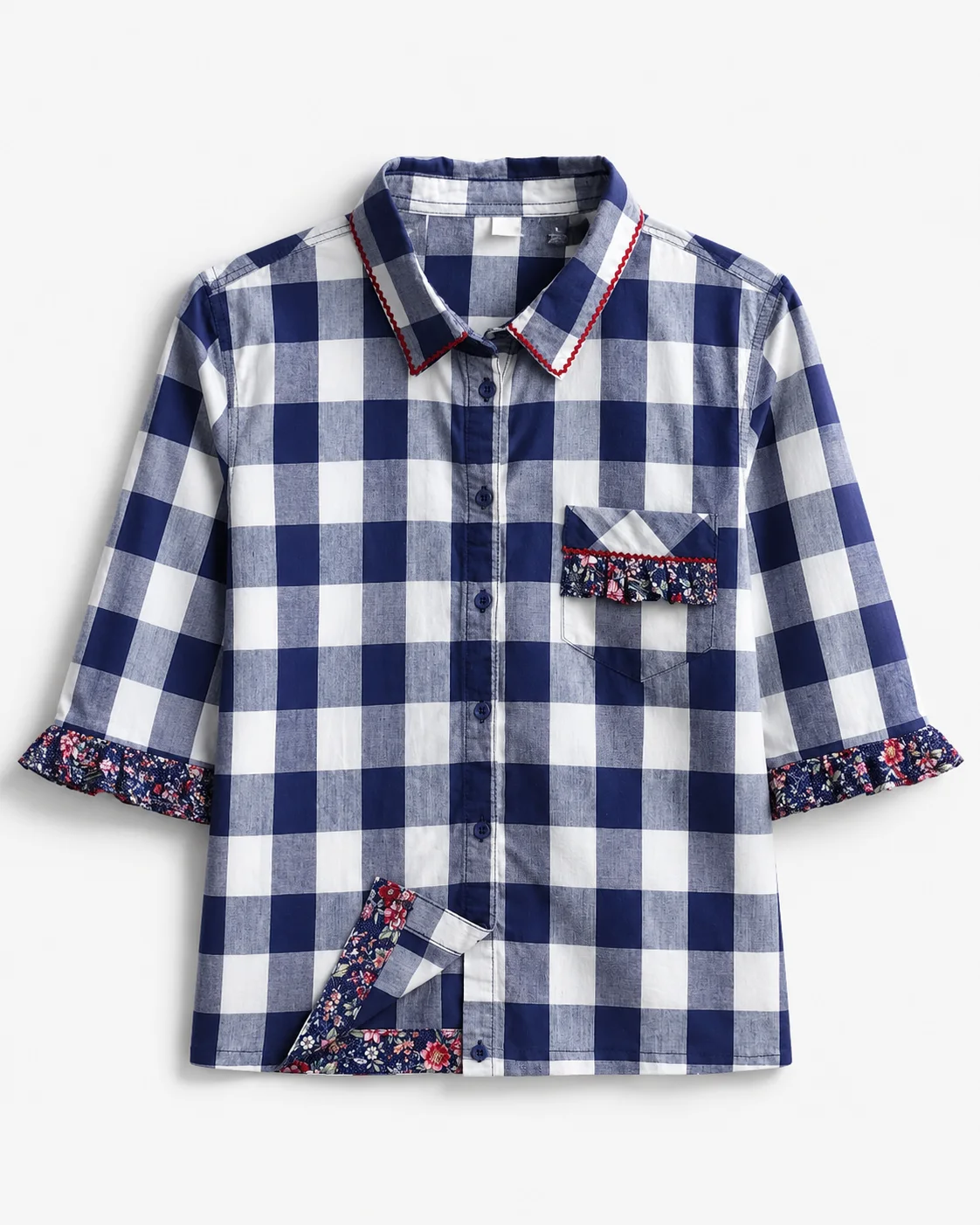 Misti — navy and white gingham button-front blouse with floral trimmed cuffs, floral hem detail and embellished chest pocket, flat lay