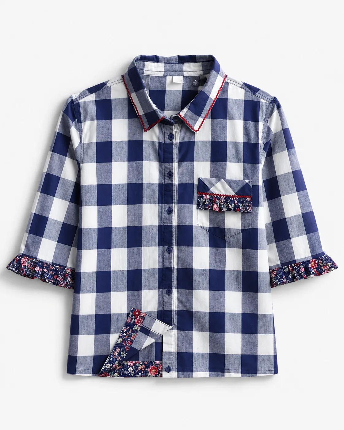 Misti — navy and white gingham button-front blouse with floral trimmed cuffs, floral hem detail and embellished chest pocket, flat lay